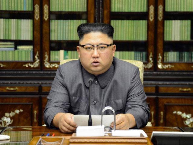 North Korean ruler Kim Jong Un reads out text in response Donald Trump's speech at the UN (AFP PHOTO/KCNA VIA KNS)