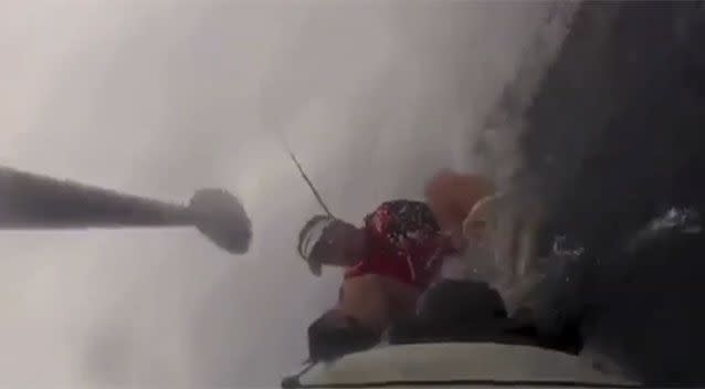 After the shark hit the kayak it flipped over. Source: YouTube.