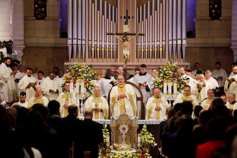 FILE PHOTO - Acting Latin Patriarch of Jerusalem Pierbattista Pizzaballa leads a Christmas midnight mass in the Church of the Nativity, in Bethlehem in the Israeli-occupied West Bank