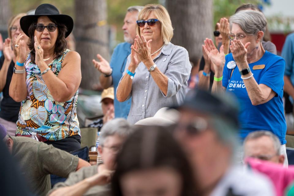 People clap between speakers during the Polk County Democrats Steak Fry at Water Works Park on Saturday, Sept. 14, 2024, in Des Moines.