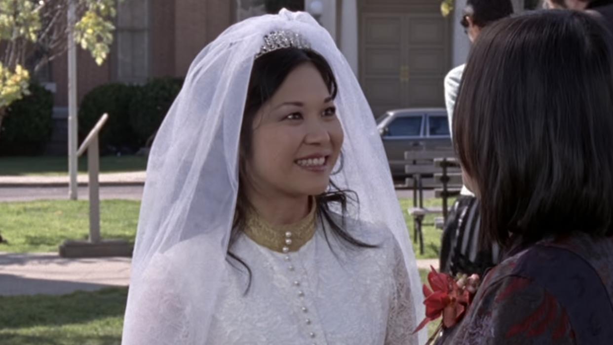  Keiko Agenda smiling as Lane Kim on her wedding day. 