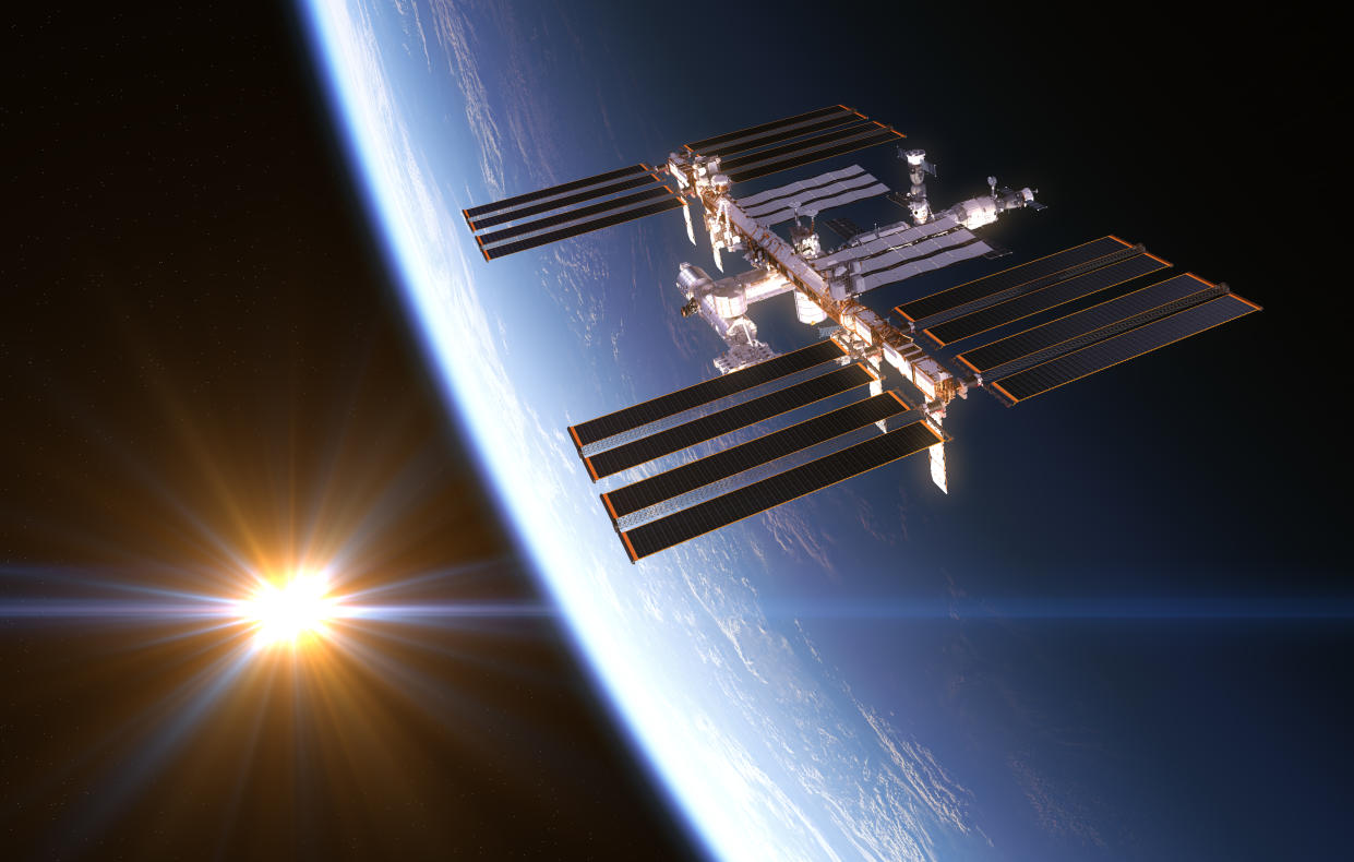 International Space Station On Background Of Rising Sun. 3D Illustration.
