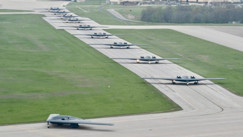 B-2 stealth bombers assigned to the 509th Bomb Wing taxi on the runway at Whiteman Air Force Base, Missouri, on April 15, 2024. Team Whiteman executed a mass fly-off of 12 B-2s to cap off the annual Spirit Vigilance exercise. <em>U.S. Air Force photo by Airman 1st Class Hailey Farrell</em> <em>U.S. Air Force photo by Airman 1st Class Hailey Farrell</em>