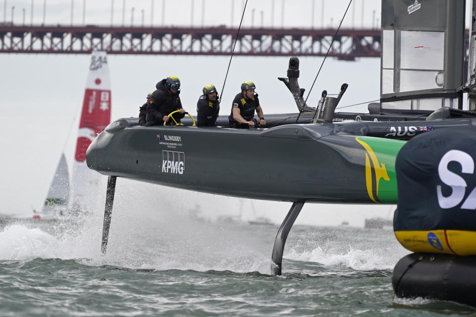 The Australia SailGP catamaran prepares to round a mark before their $1 million, winner-take-all Season 2 finale of the Mubadala United States Sail Grand Prix, Sunday, March 27, 2022, in San Francisco. Australia won the race the three-boat race against the United States and Japan. (AP Photo/Eric Risberg)