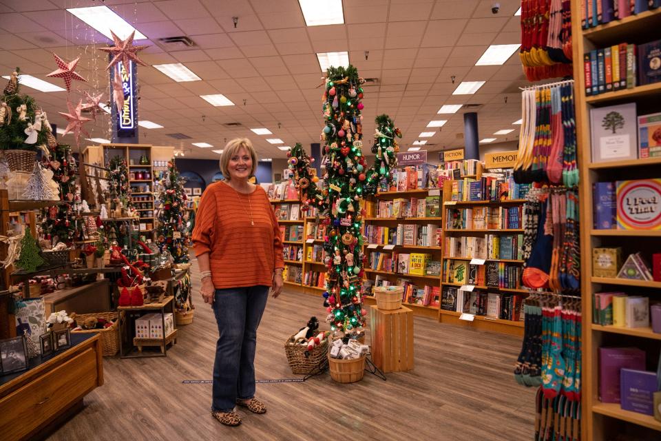 Kim Saltzstein, general manager and head buyer of Changing Hands Bookstore, poses for a portrait at the company’s location in Tempe on November 10, 2023.