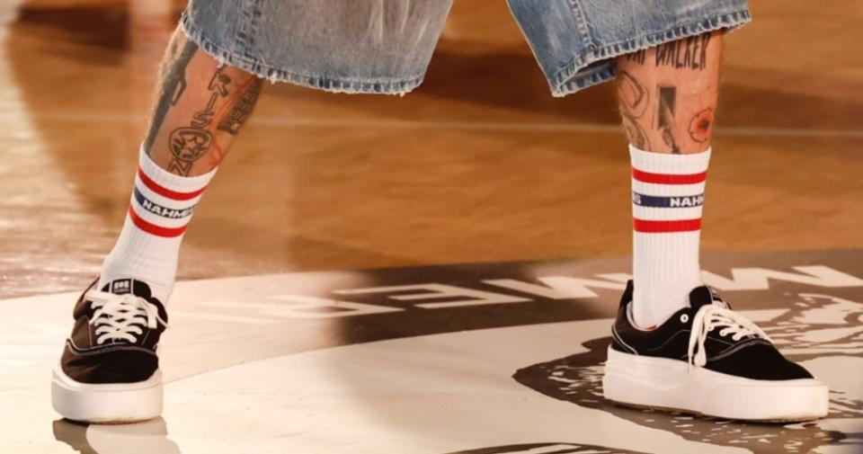 A closer look at "The Ollie" sneakers worn by Machine Gun Kelly at the Nahmias SS25 show