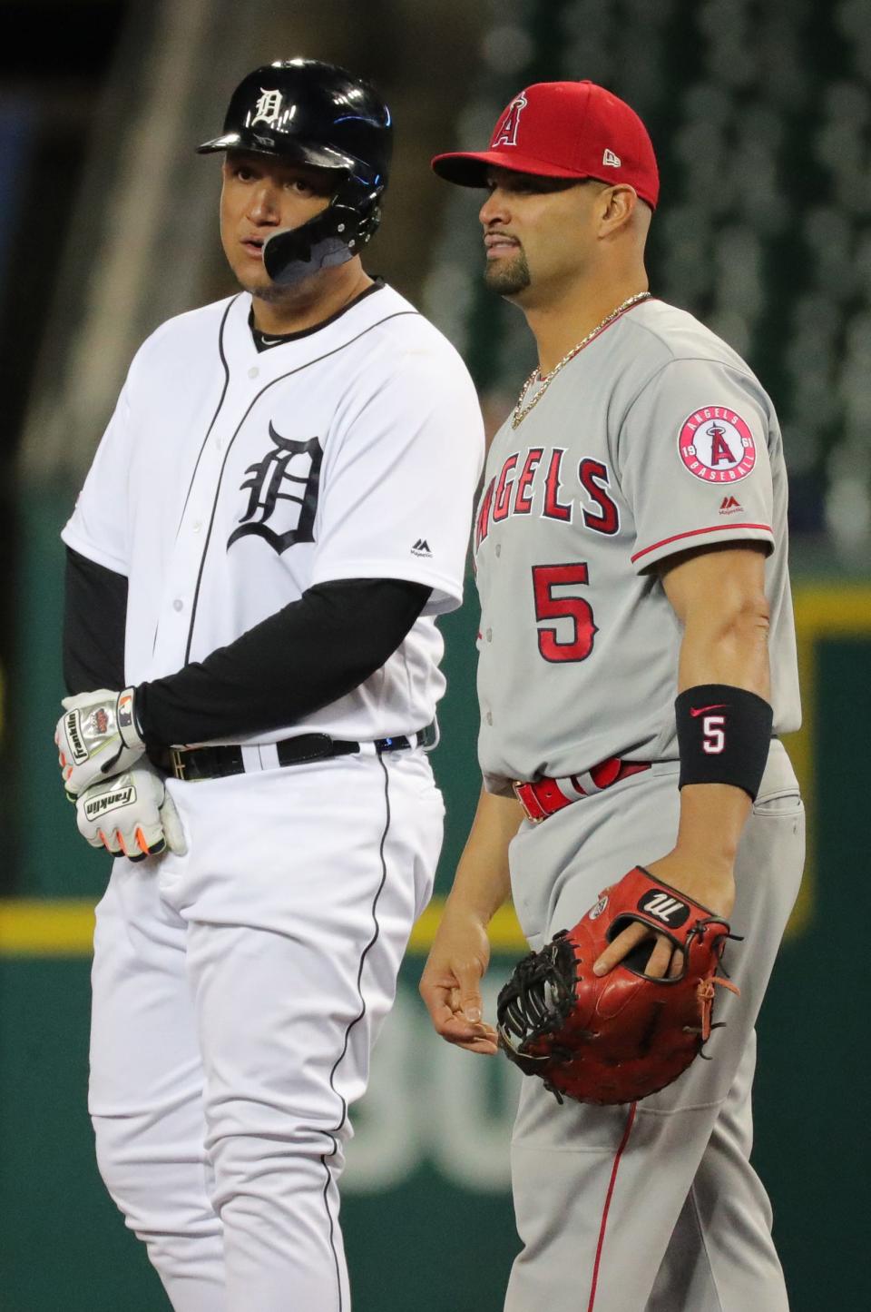  Los Angeles Angels first baseman Albert Pujols talks with  Detroit Tigers DH Miguel Cabrera during sixth inning action Tuesday, May 7, 2019 at Comerica Park in Detroit, Mich.