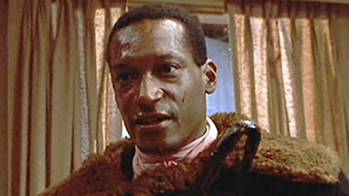 the candyman wields a hook in a scene from 'candyman,' a good housekeeping pick for best halloween movies