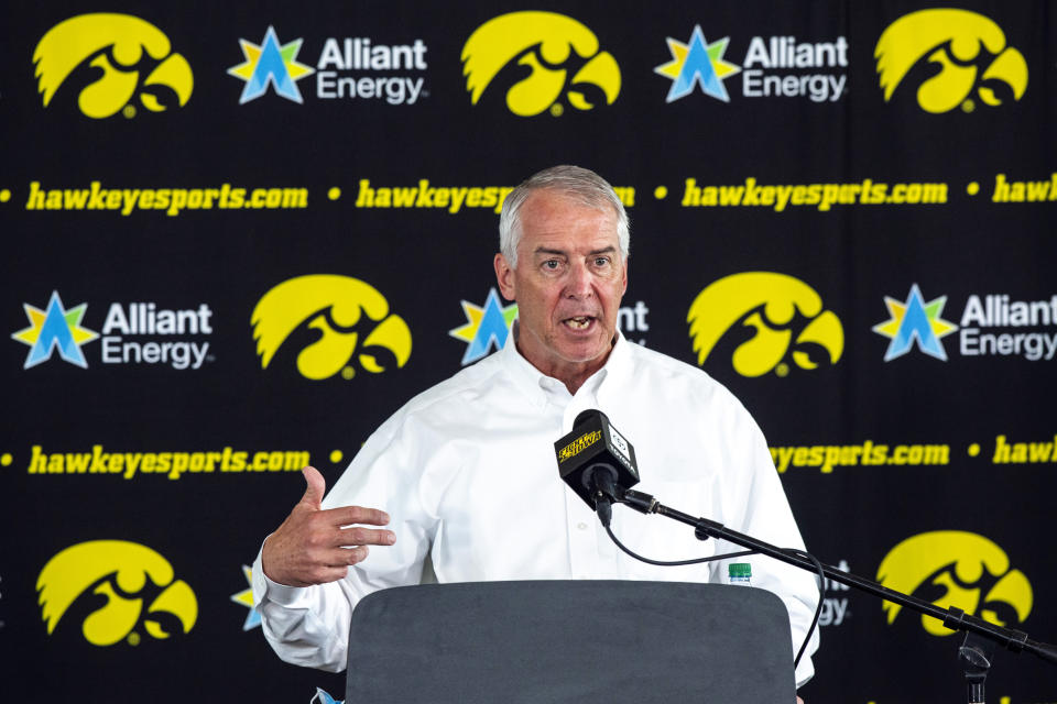 FILE - Iowa athletic director Gary Barta answers questions during a news conference in Iowa City, Iowa, June 15, 2020. A proposed settlement for more than $4 million has been reached in the lawsuit brought by former Iowa football players who alleged racial discrimination in coach Kirk Ferentz's program. The office of State Auditor Rob Sand disclosed the proposed settlement on Monday, March 6, 2023, and he was scheduled to speak at a news conference where he will announce his opposition to using taxpayer money to pay a portion of the settlement unless university athletic director Gary Barta is fired. (Joseph Cress/Iowa City Press-Citizen via AP, File)