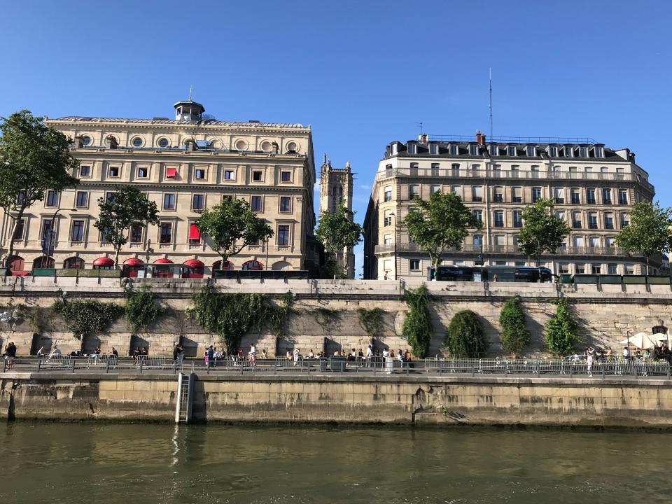photo of two building in paris from a boat on the seine