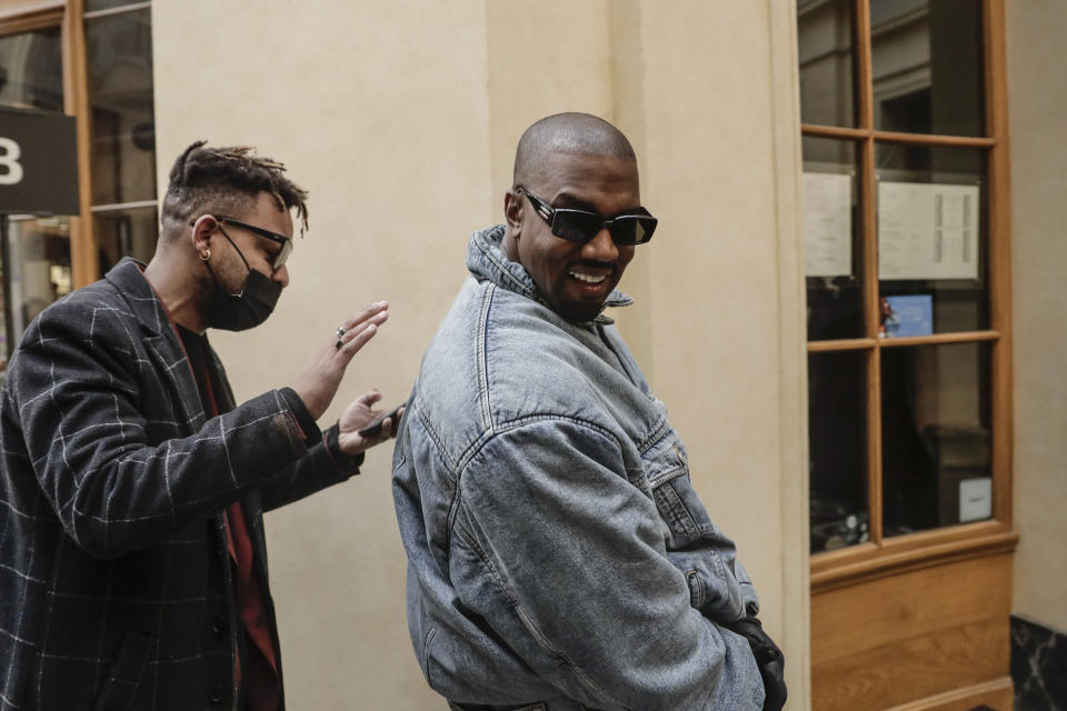 Kanye West attends the Kenzo fall-winter 22/23 men's collection, in Paris, Sunday, Jan. 23, 2022. (AP Photo/Lewis Joly)