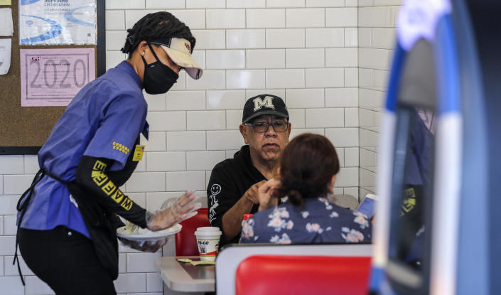 Customers at a Waffle House restaurant in Brookhaven, Ga.  on Monday, April 27, 2020. (John Spink/Atlanta Journal-Constitution via AP)