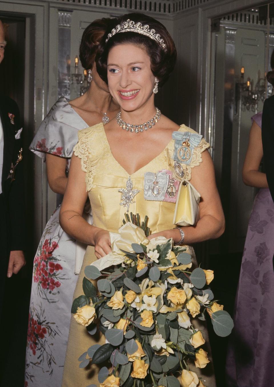 Princess Margaret (1930 - 2002) wearing a yellow evening dress, circa 1970