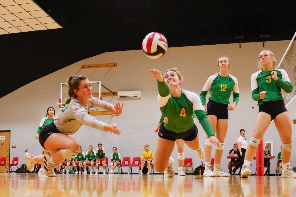 Idalou's Maddie Holmes (4) dives for a ball during the Shallowater volleyball tournament on Saturday, Aug. 13, 2022, at Shallowater High School.