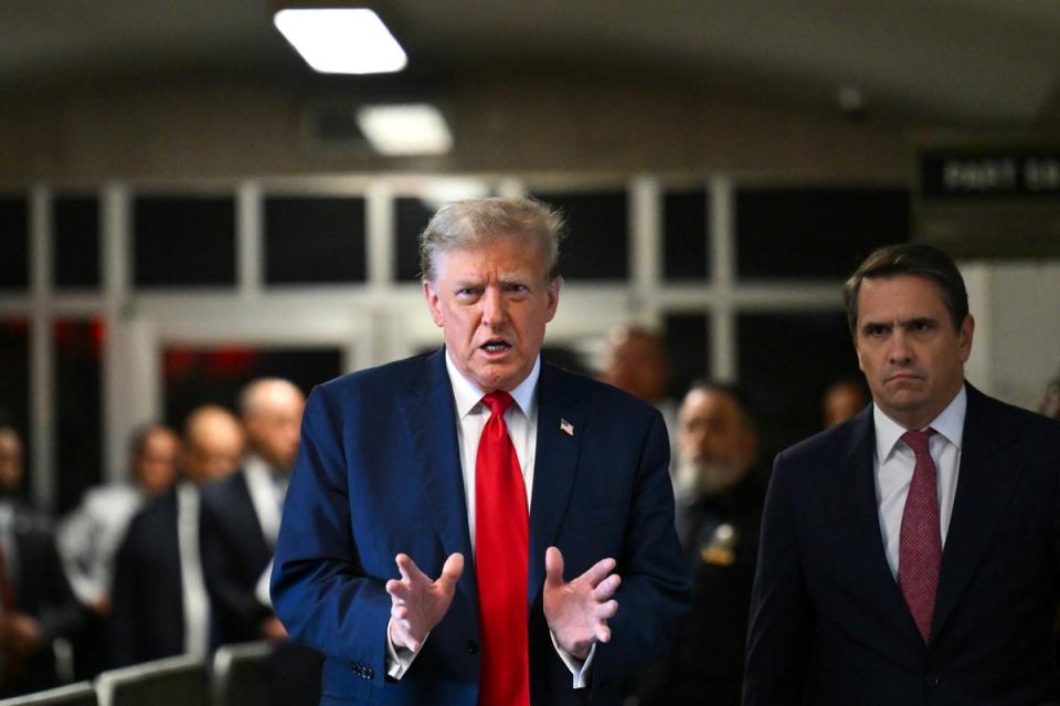 Donald Trump blames his political enemies and slams the criminal case as he holds an impromptu press conference outside court (AP)