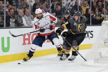 May 30, 2018; Las Vegas, NV, USA; Washington Capitals left wing Alex Ovechkin (8) battles for the puck with Vegas Golden Knights defenseman Nate Schmidt (88) in the third period in game two of the 2018 Stanley Cup Final at T-Mobile Arena. Gary A. Vasquez-USA TODAY Sports