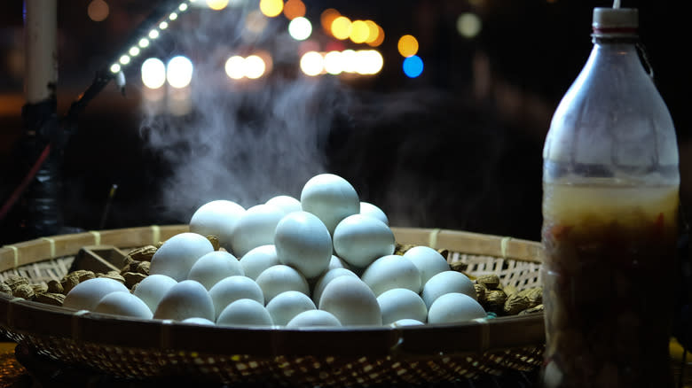 A basket of balut being sold in a street stall