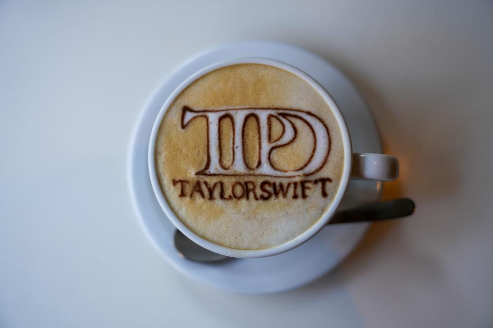 Latte art from a coffee shop in Tokyo features the logo of Taylor Swift's 11th album, "The Tortured Poets Department."