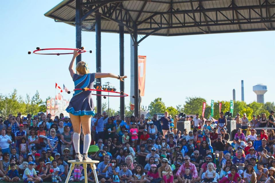 BexInMotion, seen here performing at BuskerFest 2022, is a hula hoop entertainer who incorporates fire, comedy, acrobatics and juggling into her show.