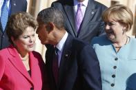 Brazil's President Dilma Rousseff, U.S. President Barack Obama and German Chancellor Angela Merkel (L-R) arrive for the family picture event during the G20 summit in St.Petersburg September 6, 2013. REUTERS/Grigory Dukor (RUSSIA - Tags: POLITICS BUSINESS)