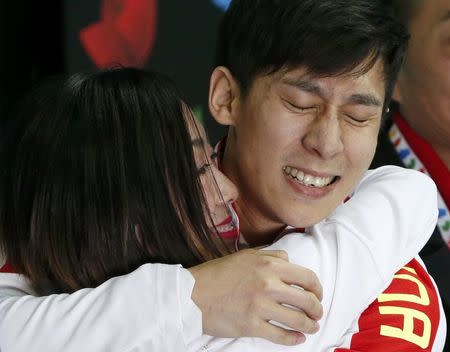 Figure Skating - ISU World Championships 2017 - Pairs Free Skating - Helsinki, Finland - 30/3/17 - Sui Wenjing and Han Cong of China react after the performance. REUTERS/Grigory Dukor