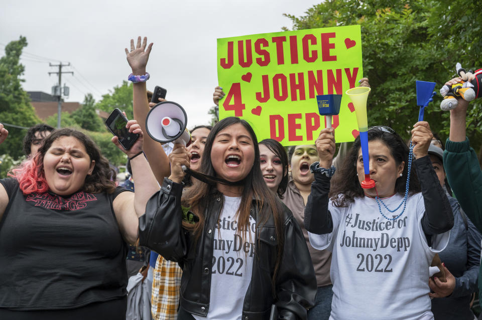 Supporters of actor Johnny Depp rally outside of Fairfax County Courthouse as a jury is scheduled to hear closing arguments in Johnny Depp's high-profile libel lawsuit against ex-wife Amber Heard in Fairfax, Va., on Friday, May 27, 2022.(AP Photo/Craig Hudson)