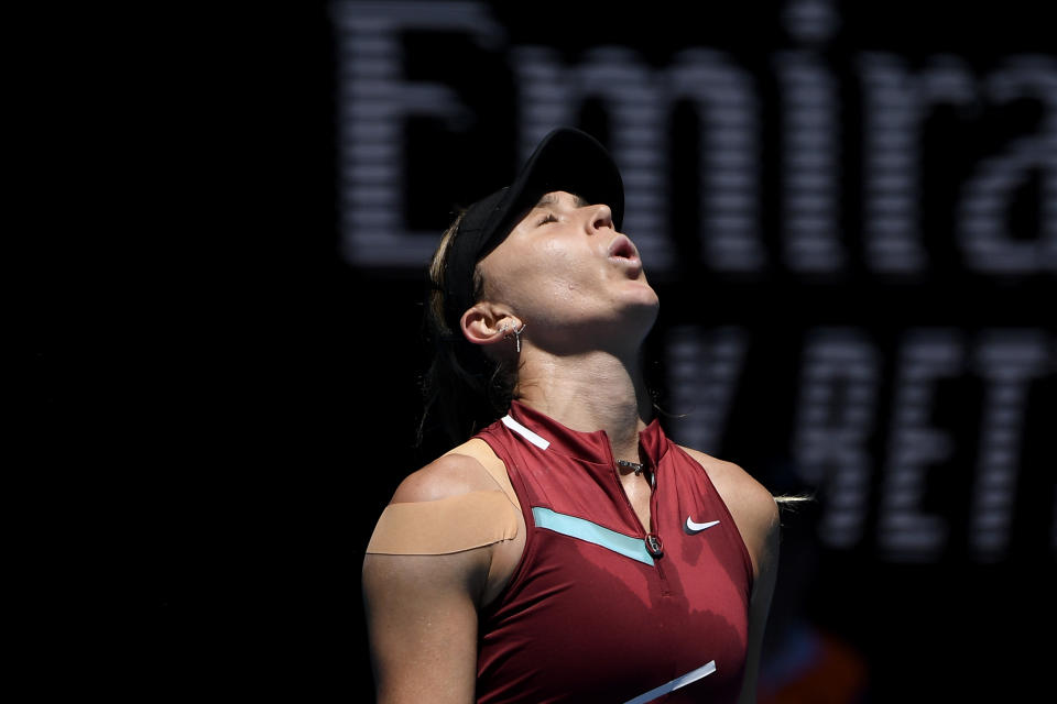 Paula Badosa of Spain reacts after defeating Martina Trevisan of Italy in their second round match at the Australian Open tennis championships in Melbourne, Australia, Wednesday, Jan. 19, 2022. (AP Photo/Andy Brownbill)