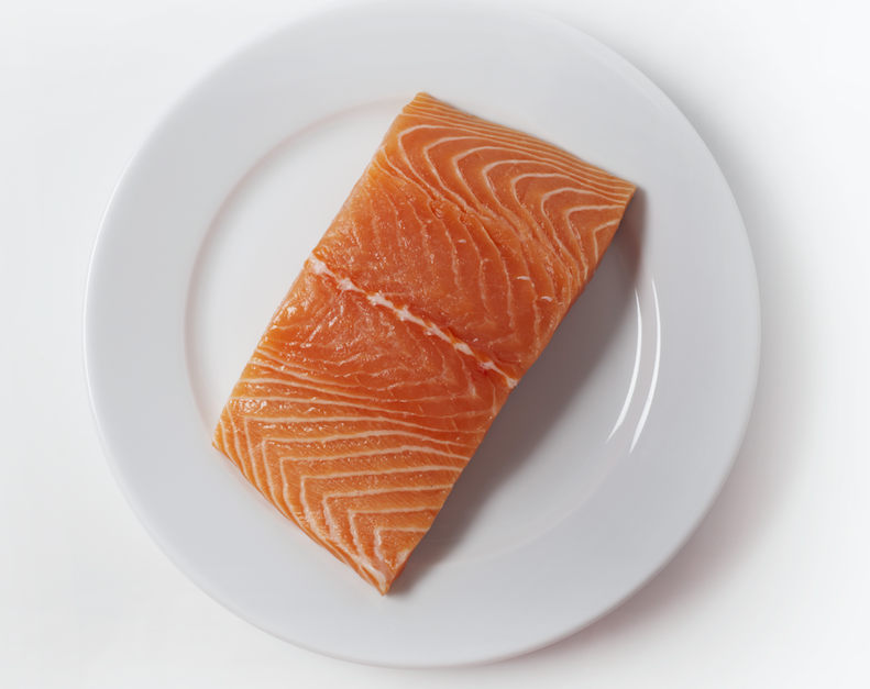 <p>We need to eat an optimal of 250mg of seafood omega-3 fats per day, found in salmon.<br> (Picture: Rex) </p>