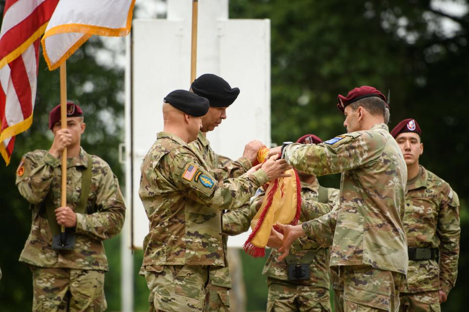 Command Sgt. Maj. Gregory Seymour, Col. John Wilcox, Lt. Gen. Christopher Donahue and Command Sgt. Maj. T.J. Holland uncase the Fort Liberty garrison colors during the Fort Liberty redesignation ceremony on Friday, June 2, 2023.