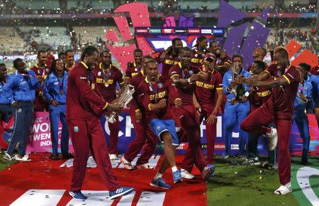 Cricket - England v West Indies - World Twenty20 cricket tournament final - Kolkata, India - 03/04/2016. West Indies players celebrate with the trophy after winning the final. REUTERS/Adnan Abidi