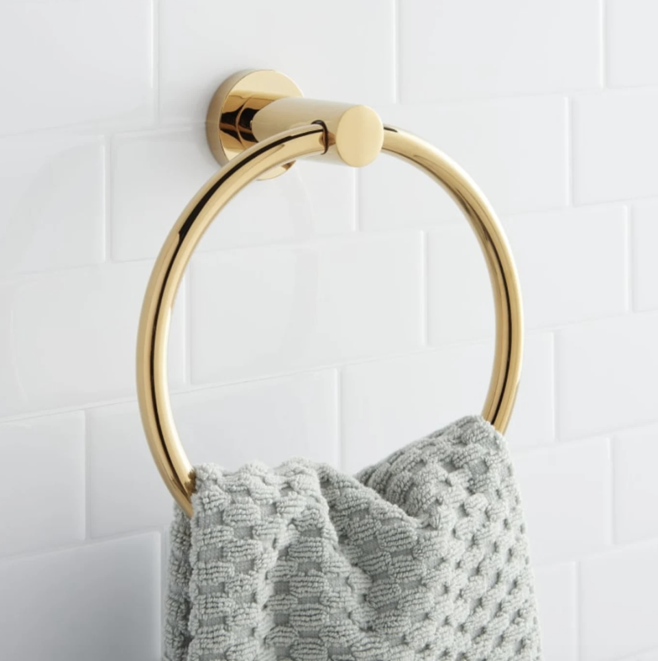 Signature Hardware Brass Towel Ring with gray towel