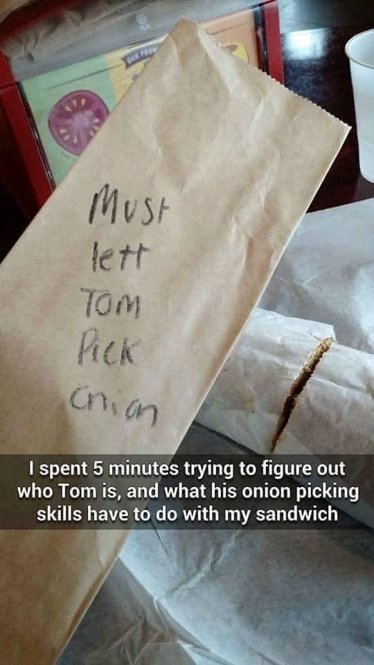 Takeout food bag with writing that says "must lett tom pick onion"