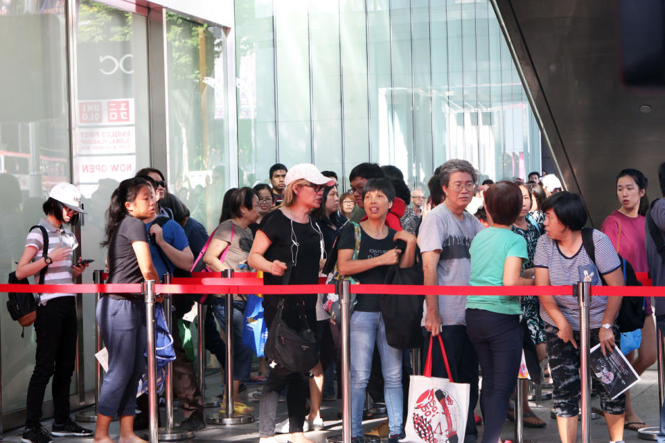People queued as early as 7am on Friday (2 Sept) for the opening of Uniqlo’s global flagship store in Singapore, located at Orchard Central. (Photo: Sharlene Maria Sankaran/Yahoo Singapore)