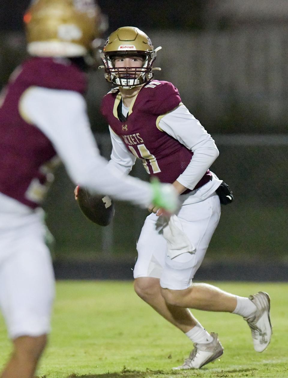 St. Augustine's Locklan Hewlett (11) looks for a receiver against Choctawhatchee. The Jackets face Fort Myers Dunbar on Friday for a spot in the FHSAA Class 3S football final.