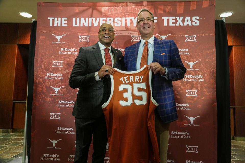 New Texas basketball coach Rodney Terry poses with athletic director Chris Del Conte at an introductory press conference March 27. Terry led UT to a 29-9 record and an appearance in the NCAA Elite Eight.