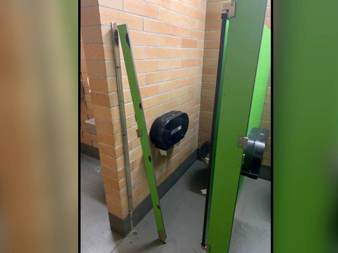 The public washrooms in Swalwell Park in Lake Country, B.C., have been repeatedly targeted by vandals who have torn off stall doors, burned soap dispensers and spread feces on the walls.  (District of Lake Country/Facebook - image credit)