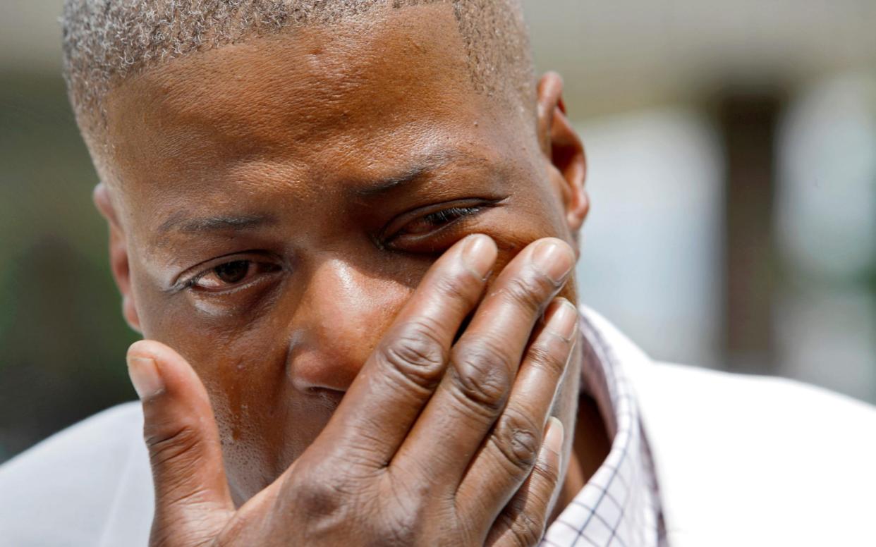 aTonya Floyd, sister of George Floyd, wipes away tears while speaking to the media about her dead brother, before a memorial in the town where he was born, in Raeford, North Carolina -  JONATHAN DRAKE/Reuters