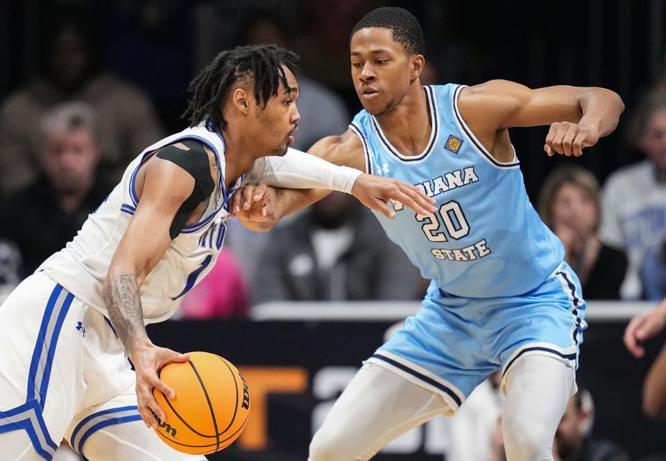 Indiana State wing Jayson Kent, right, guards Seton Hall's Dre Davis in the NIT championship game earlier this month. The 6-foot-8 Kent, who will be a fifth-year senior next fall, committed to Texas on Sunday.