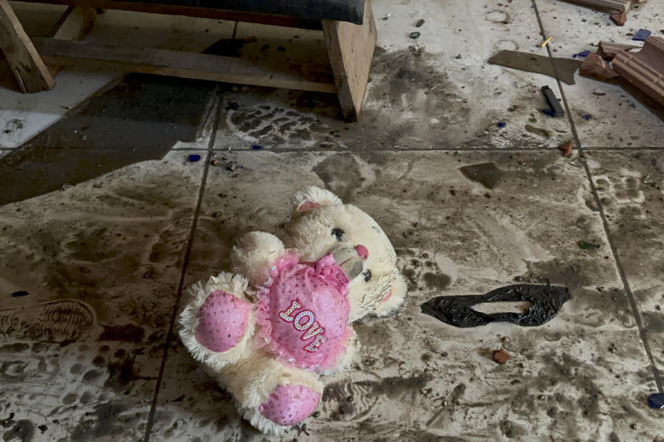 FILE - A teddy bear is rest on the floor following an Israeli airstrike in Nusseirat refugee camp in Gaza Strip on Oct. 31, 2023. In just 25 days of war, more than 3,600 Palestinian children have been killed in Gaza, according to Gaza's Hamas-run Health Ministry. The advocacy group Save The Children says more children were killed in Gaza in October 2023 than in all conflict zones around the world combined in 2022. (AP Photo/Doaa AlBaz, File)