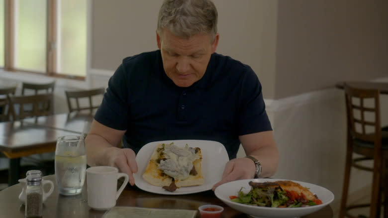 Gordon Ramsay stares down at a melted cheese sandwich