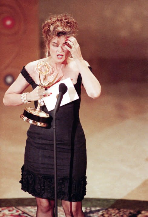 Actress Kirstie Alley reacts on stage after being presented with the Emmy for the best actress in a comedy series for her in “Cheers” Sunday, Aug. 26,1991 in Pasadena, Calif.(AP Photo/Nick Ut)