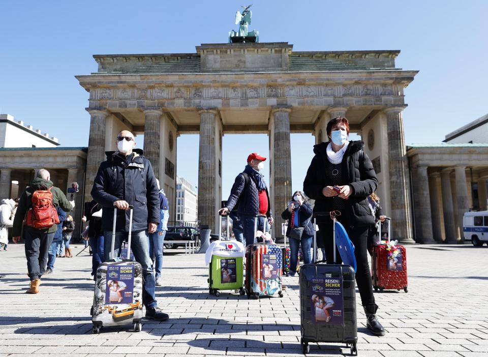 People take part in a demonstration demanding government to build a strategy for public to travel safely at the Brandenburg Gate in Berlin - Getty