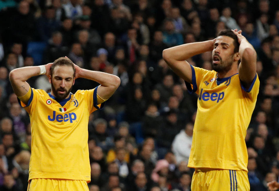 <p>Soccer Football – Champions League Quarter Final Second Leg – Real Madrid vs Juventus – Santiago Bernabeu, Madrid, Spain – April 11, 2018 Juventus’ Sami Khedira and Juventus’ Gonzalo Higuain react REUTERS/Paul Hanna </p>