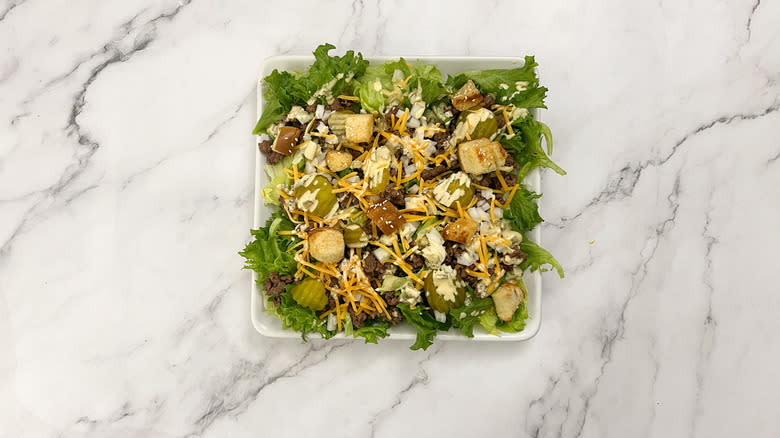 salad with hamburger bun croutons