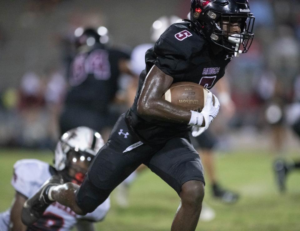 Tyrell Marshall (5) returns a kickoff during the West Florida vs Navarre preseason football game at Navarre High School on Friday, Aug. 18, 2023.