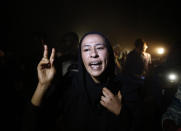 FILE - In this June 19, 2019 file photo, a Sudanese protester chants slogans against the military council, in Khartoum. Sudan’s uprising has ushered in a new era both for the nation and for Sudanese women after three decades of autocratic rule by Omar al-Bashir. Sudanese women played a pivotal role in the protests that brought down al-Bashir, and under a joint military-civilian council in power now, they hope for more freedom and equality, and seek to overturn many of the restrictive Islamic laws from the previous era. (AP Photo/Hussein Malla, File)