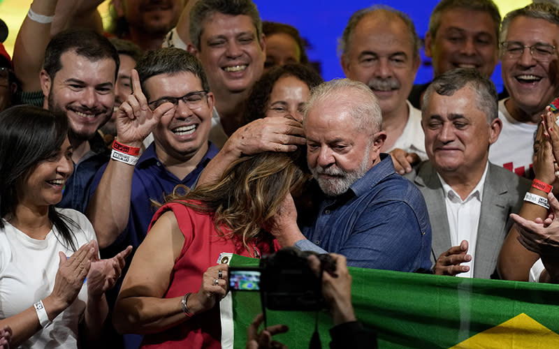 Former Brazilian President Luiz Inacio Lula da Silva embraces his wife