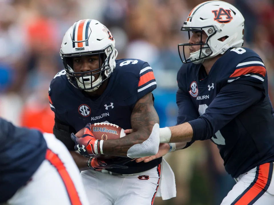 Auburn’s Jarrett Stidham (8) hands the ball off to Auburn’s Kam Martin (9) at Jordan-Hare Stadium in Auburn, Ala., on Saturday, Sept. 29, 2018. Auburn leads Southern Miss 14-3, the game went into a weather delay with 4:27 left in the second quarter.