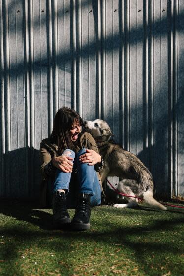 Lancaster, CA - January 21: Rita Earl Blackwell interacts with Missy at the Lancaster Animal Care Center.