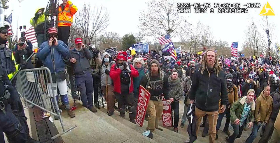 Knight wit dreadlocks, right, with a large crowd at the Capitol . (U.S. Attorney's Office for the District of Columbia)